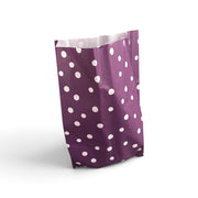 Lahjapussi, violetti, pilkullinen. Korkeus 49 cm. 250 kpl.